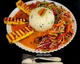 A picture of step 4 of Spicy Grilled Paneer Steak Italian Herb Rice Schezwan Sauce With Exotic Sautéed Veggies Gourmet Meal.
