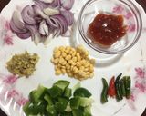 A picture of step 2 of Spicy Tawa Idli.