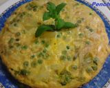Foto del paso 7 de la receta Tortilla de guisantes, cebolletas tiernas, y patatas a la hierbabuena