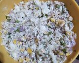 A picture of step 3 of Dhokla in idli version stuffed with cheezee rice patty.