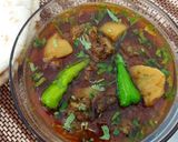 A picture of step 8 of Aloo Goasht.