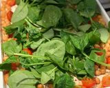 A picture of step 4 of Halloumi with pesto, balsamic tomatoes, spinach and chickpeas.