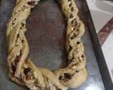A picture of step 8 of Rosca de Reyes Filled with Dried Fruit and Cream Cheese Glaze.