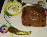 A picture of step 4 of Oats paratha with cucumber raita.