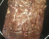 A picture of step 2 of Flank Steak on a bed of Onions.