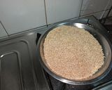 A picture of step 8 of Dodha Burfi with Daliya.