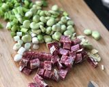 A picture of step 1 of Basque sausage, goats cheese, broad bean and spring onion salad.