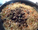 A picture of step 6 of Spaghetti with Rabbit Ragù, Mushrooms, and Walnuts.