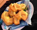 A picture of step 40 of Chessy-Chicken filled bowtie buns.