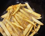 A picture of step 2 of Masala fries.