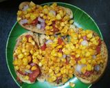 A picture of step 2 of Cheesy corn garlic bread pizza.