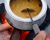A picture of step 2 of Desi Masar and moong daal Mix on wood fire.