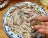 A picture of step 6 of Microwave Marinated Anchovies with Olive Oil, Lemon, Salt, and Pepper.