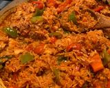 A picture of step 4 of Spanish style tomato and chicken baked rice.