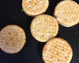 A picture of step 2 of Chocolate covered Ritz crackers filled with white chocolate or peanut butter.