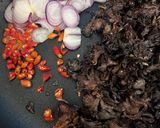 A picture of step 4 of Mushroom stir fry with Bak Choy, Chilies and Sausage.