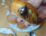 A picture of step 13 of Mardi Gras Chocolate Donuts.