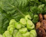 A picture of step 5 of Meatballs with nouc cham, cucumber and mint.
