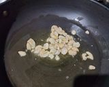 A picture of step 3 of Custard powder halwa with roasted sesame seeds.
