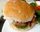 A picture of step 3 of My Roast pork, Balsamic glaze on Crusty Cob with salad & chips.