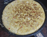 Foto del paso 4 de la receta: Tortilla de papas con cebolla caramelizada y pimiento del piquillo