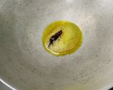 A picture of step 3 of Pumpkin Saag(kumro) with Moong dal and Coconut.