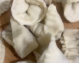 A picture of step 10 of Dumplings served with chilli oil and soya sauce dipping.