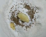 A picture of step 3 of Kashmiri Khatte Baigan with Khasta Puri.