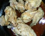 A picture of step 6 of Spicy wings with sauce.
