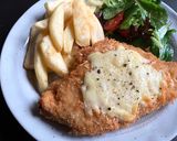 A picture of step 7 of Chicken Parma.