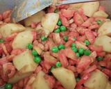 A picture of step 3 of Aloo matar gajar mix veggies.