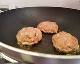 A picture of step 7 of Bring-a-smile chicken burgers with blue cheese or pesto filling 😊.