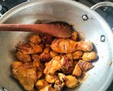 A picture of step 2 of Butter chicken served with buttered Naan bread.