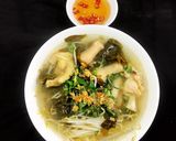 Hình bước làm 3 của món Canh Chua Gà Nấu Lá Giang