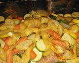 A picture of step 14 of Foil wrapped honey mustard pork loin with zucchini, squash, and baby carrots.