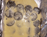 A picture of step 2 of Oreo cheesecake bars.