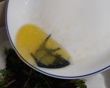 A picture of step 2 of Wilted greens with apples, raisins & nuts.