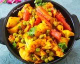 A picture of step 6 of Cauliflower, Potato, Peas, and Carrot Curry.