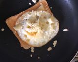 A picture of step 3 of Cheesy egg toast.
