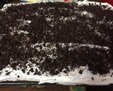 A picture of step 4 of Cookies and cream poke cake.