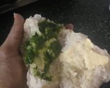 A picture of step 4 of Vadapav with green spicy chutney.