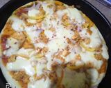 A picture of step 3 of Chicken Tikka pizza.