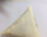 A picture of step 3 of Qeemay k Samosay (How to wrap samosa step by step).