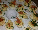 A picture of step 7 of truffle deviled eggs with lox.