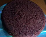 A picture of step 6 of Red velvet cake with a chocolate ganache cream frosting.