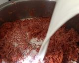 A picture of step 2 of Gajar ka halwa (colourful dish).