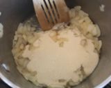 A picture of step 7 of Anti Vampire Cheese Sauce, with Onions and Garlic.