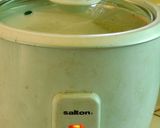 A picture of step 3 of Ellu satham (ellorai in Tamil)-Rice cooked with sesame seed masala powder.