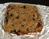 A picture of step 9 of Fresh Berrie Crumble Bars with White and Milk Chocolate Glaze.