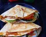 A picture of step 8 of Tortilla Wrap with egg and veggies.